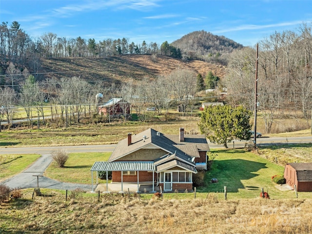 mountain view featuring a rural view