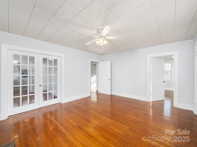 unfurnished room featuring french doors, ceiling fan, ornamental molding, and hardwood / wood-style floors