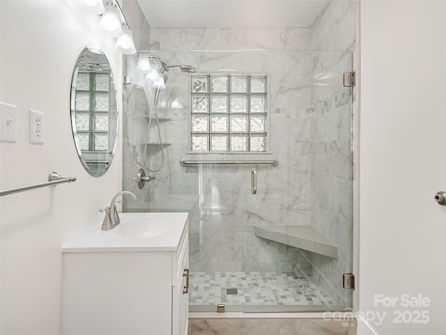 bathroom with a healthy amount of sunlight and an enclosed shower