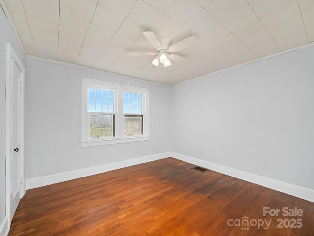 unfurnished room with hardwood / wood-style flooring, ceiling fan, and crown molding