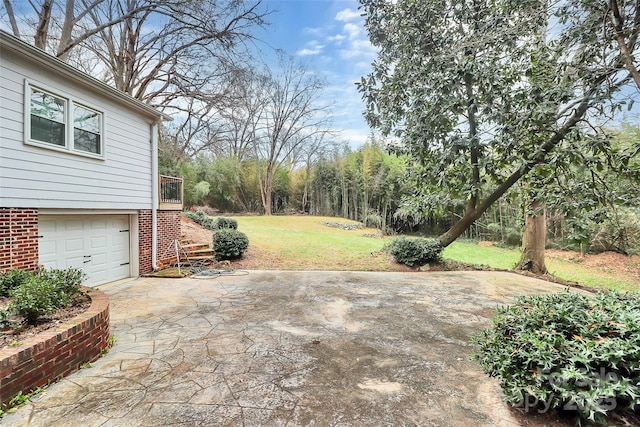 view of patio featuring a garage