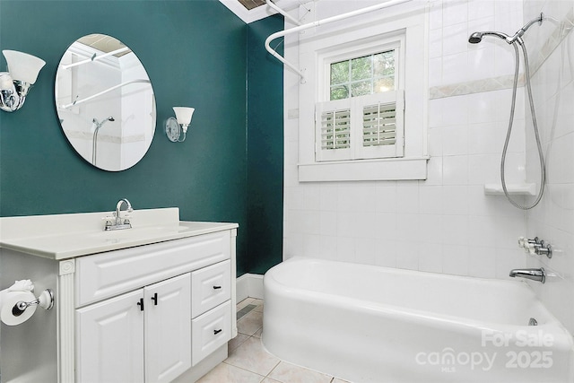 bathroom featuring vanity, tiled shower / bath combo, and tile patterned floors