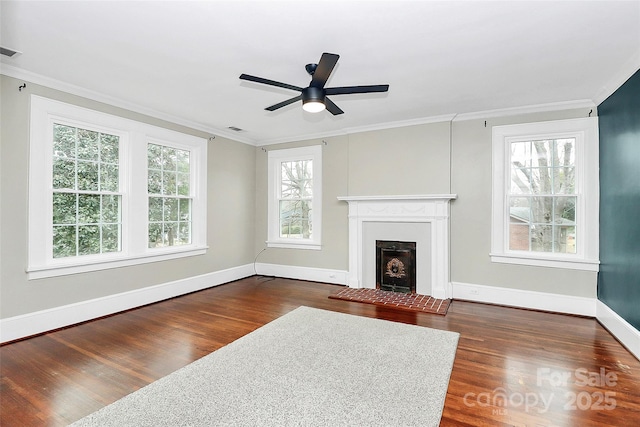 living room with dark hardwood / wood-style floors, ceiling fan, crown molding, and a wealth of natural light