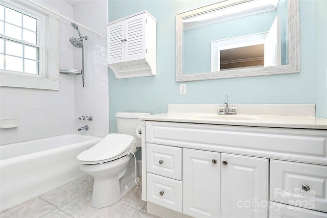 full bathroom featuring tile patterned floors, vanity, toilet, and tiled shower / bath