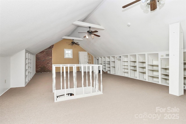 bonus room featuring light colored carpet, ceiling fan, and lofted ceiling