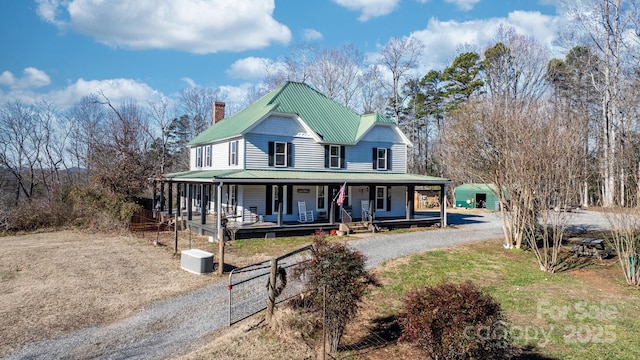 farmhouse-style home featuring covered porch