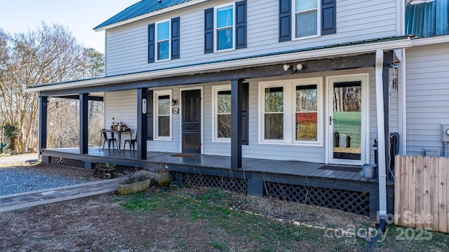 doorway to property featuring a porch