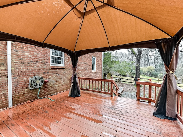 wooden deck with a gazebo