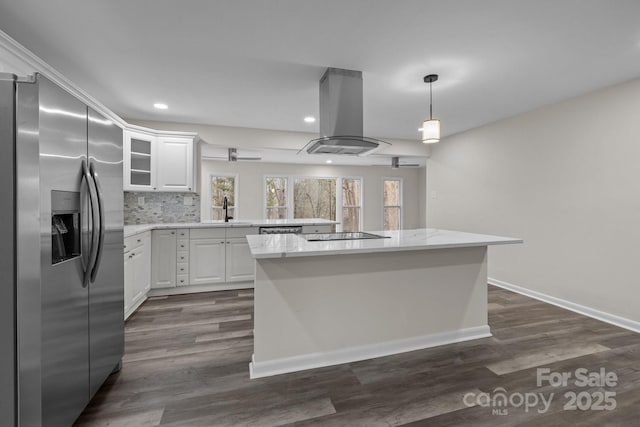 kitchen featuring island exhaust hood, stainless steel appliances, white cabinets, and sink