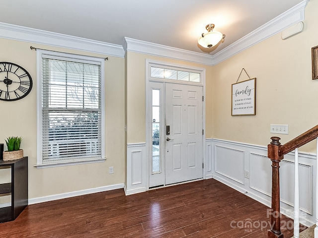 foyer with crown molding and dark wood-type flooring