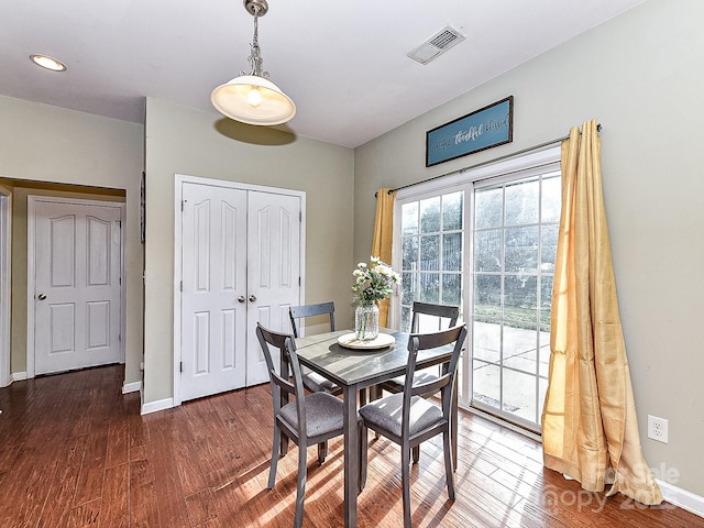 dining area featuring dark hardwood / wood-style flooring