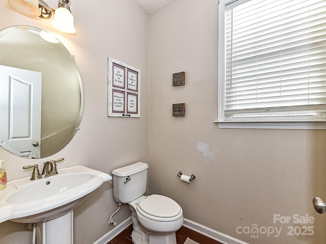 bathroom featuring toilet and sink