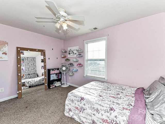 bedroom featuring ceiling fan and carpet