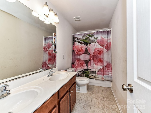 full bathroom with vanity, shower / bath combo, and toilet