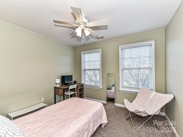 bedroom with carpet, a baseboard radiator, and ceiling fan