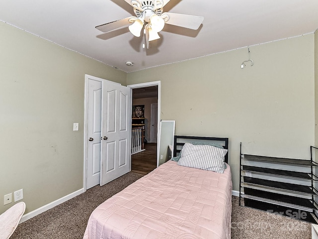 bedroom with dark carpet and ceiling fan