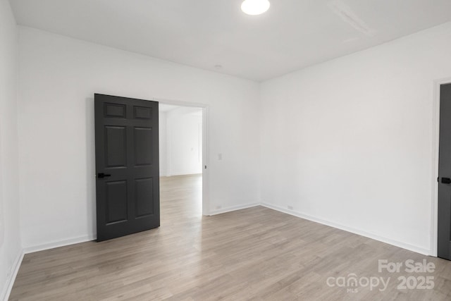 empty room with light wood-type flooring