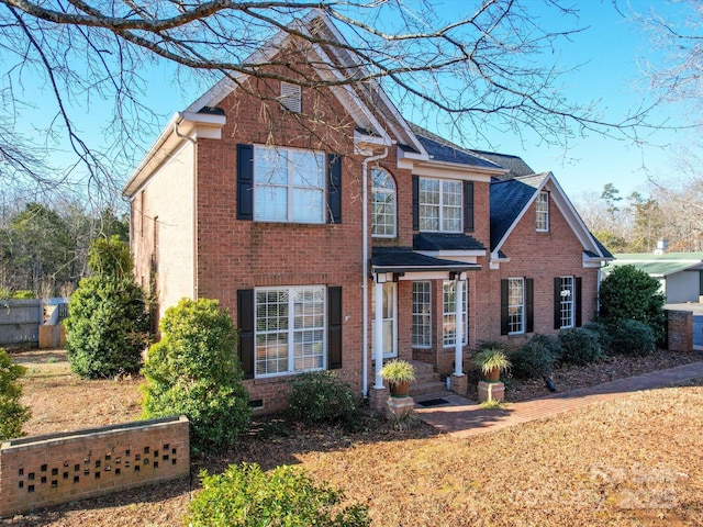 front facade with a front lawn