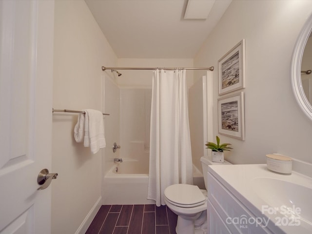 full bathroom featuring vanity, shower / tub combo, and toilet