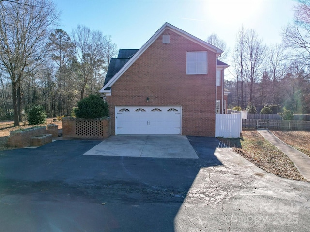 view of side of property featuring a garage