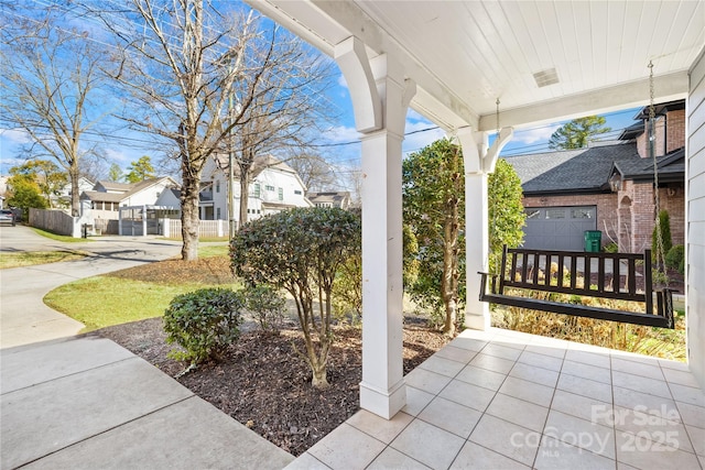 view of patio / terrace featuring a garage