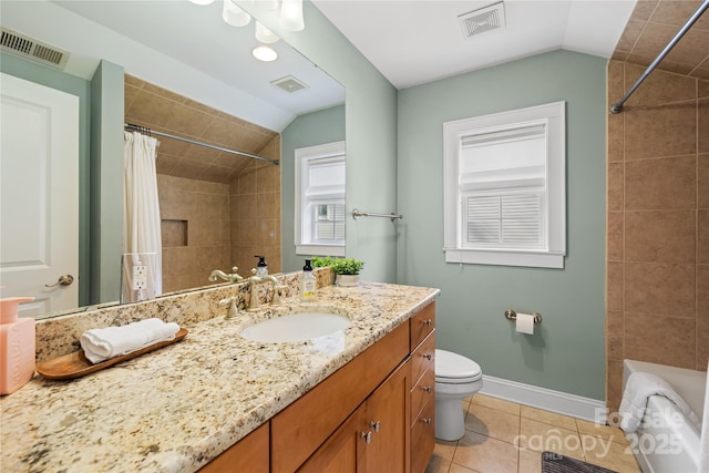 bathroom featuring vaulted ceiling, vanity, toilet, and tile patterned flooring