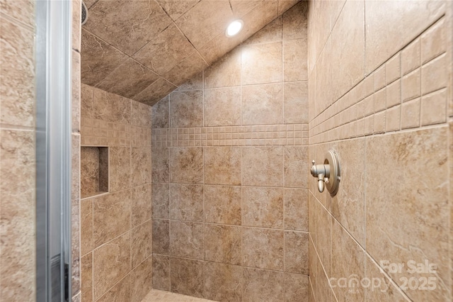 bathroom with a tile shower