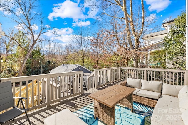 wooden deck featuring outdoor lounge area