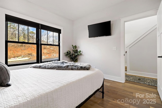 bedroom with hardwood / wood-style floors