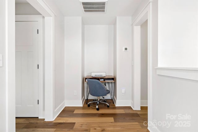 office space with hardwood / wood-style flooring