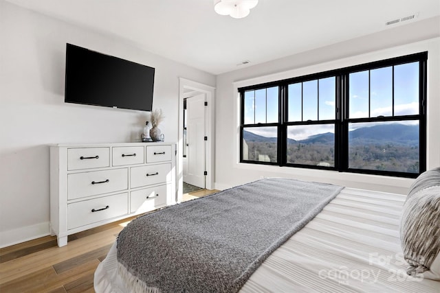 bedroom with light hardwood / wood-style flooring