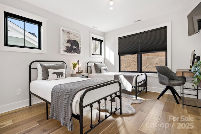 bedroom featuring light hardwood / wood-style floors