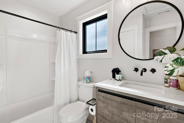 full bathroom featuring shower / bath combination with curtain, vanity, and toilet