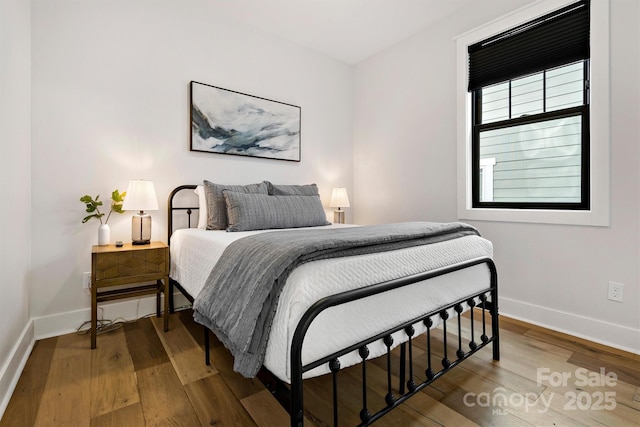 bedroom featuring hardwood / wood-style floors