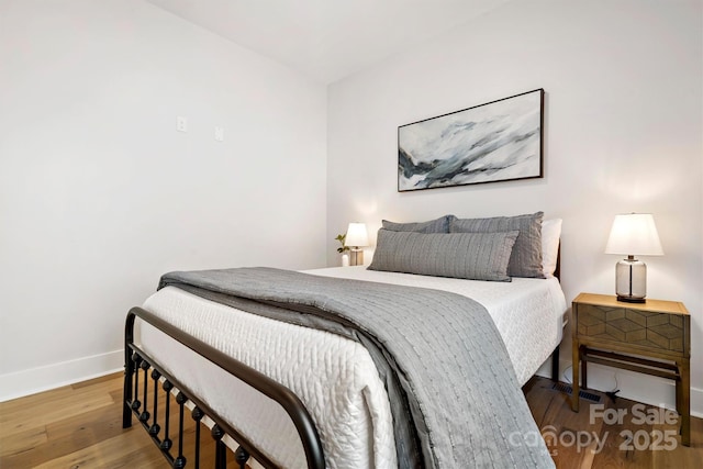 bedroom featuring hardwood / wood-style floors