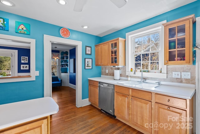 kitchen featuring dishwasher, decorative backsplash, dark hardwood / wood-style flooring, and sink