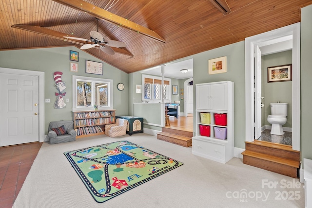 playroom with lofted ceiling with beams, ceiling fan, and wood ceiling