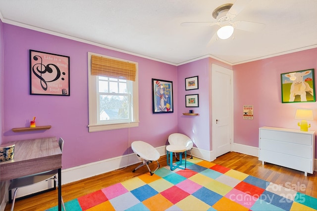 game room featuring ceiling fan, light hardwood / wood-style flooring, and ornamental molding