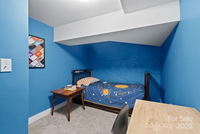 carpeted bedroom with vaulted ceiling