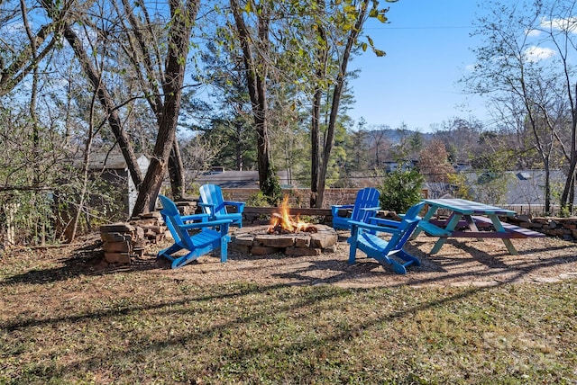 view of yard with a fire pit