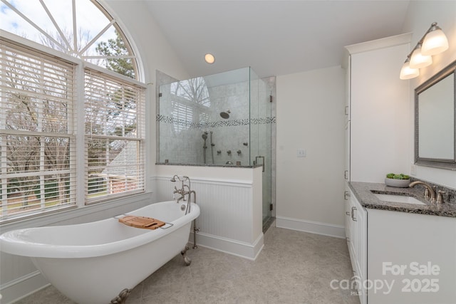 bathroom featuring vanity, vaulted ceiling, tile patterned floors, and separate shower and tub