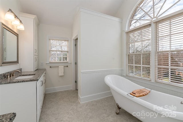 bathroom with a bathing tub and vanity