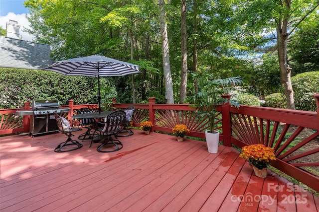 wooden deck featuring grilling area