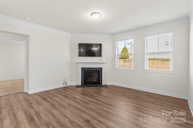 unfurnished living room featuring hardwood / wood-style flooring and ornamental molding