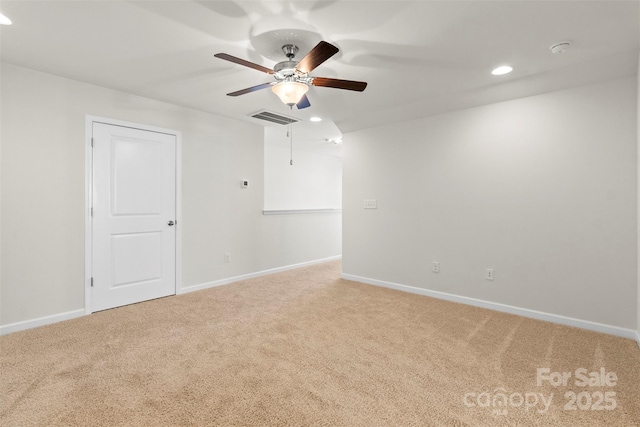 empty room with carpet flooring and ceiling fan