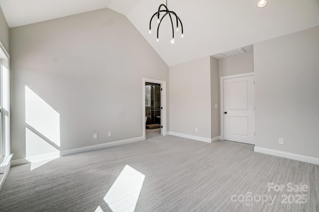 interior space with a notable chandelier and high vaulted ceiling