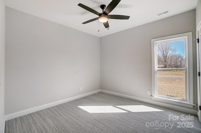 spare room with light carpet and ceiling fan