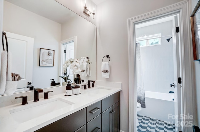 full bathroom featuring shower / tub combo with curtain, vanity, and toilet