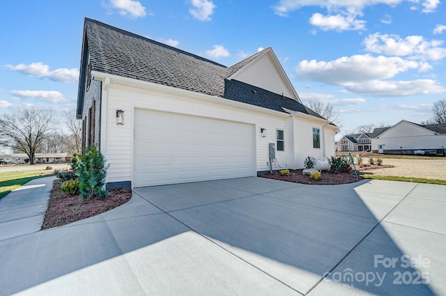 view of side of home featuring a garage