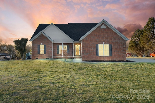 ranch-style house with a yard